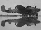 320__0001 - Aircraft fitters work on a B-25 Mitchell prior to a raid into occupied France
