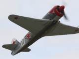 FL2006_023 - a YAK 3 pulls up into a steep climb