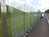 Dux2007_006 - the wall of rememberance along the pathway up to the entrance of the American Air Museum at Duxford. Each aircraft etched into the glass is one aircraft lost during WW2